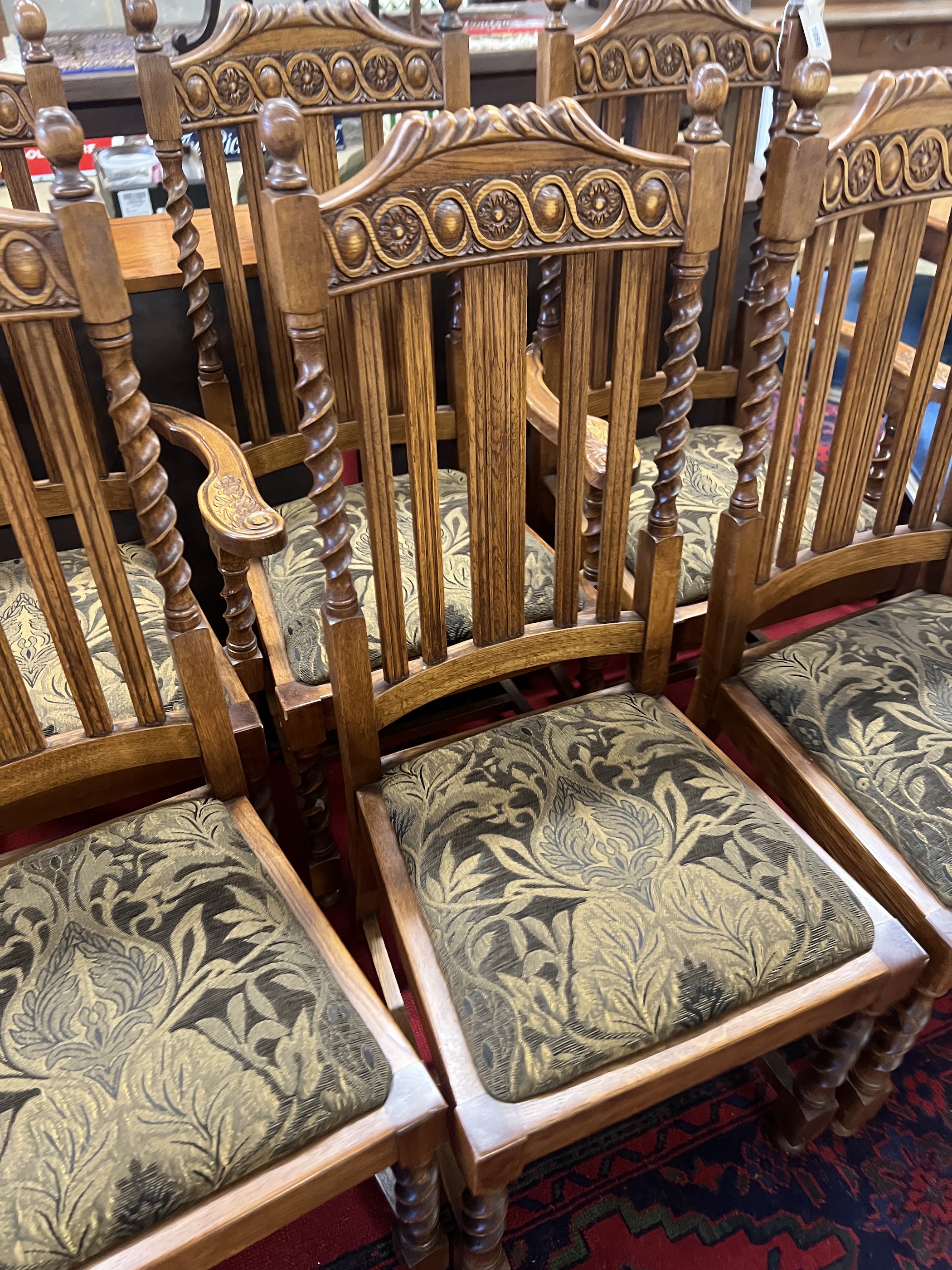 A set of six 1920's oak barley twist dining chairs, two with arms